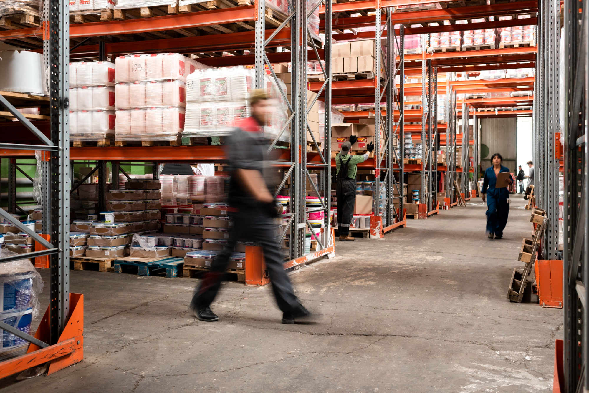 Warehouse manager inside a modern logistics facility.